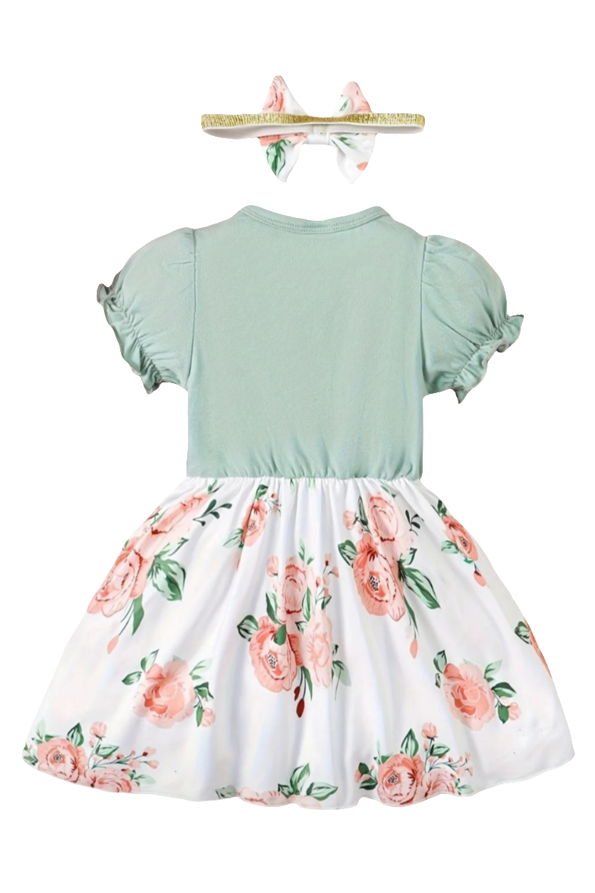 Jurkje wit met bloemen met vast groen vestje en haarband.