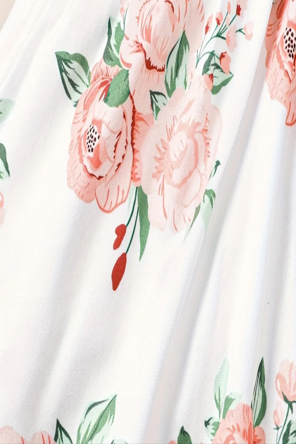 Jurkje wit met bloemen met vast groen vestje en haarband.