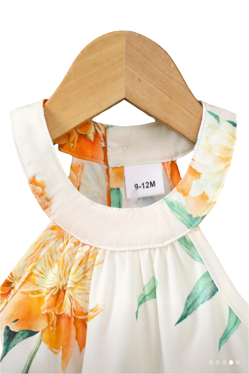 Jurkje wit met bladprint geel en  lichtgroen ( te combineren met de  gele schoentjes)