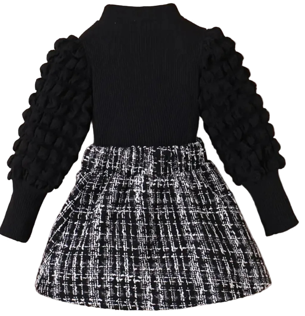 setje zwarte top met aparte mouwen en geruit rokje in zwart wit