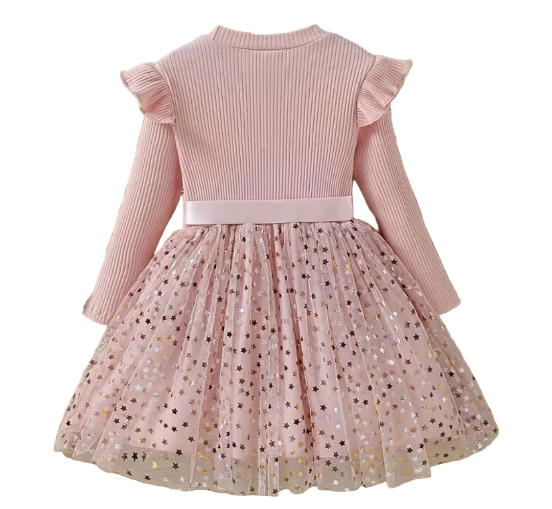 jurk voor Kerst. Bovenzijde van tricot en onderzijde van tule met gouden spikkels. In roze ,zwart en wijnrood  verkrijgbaar.