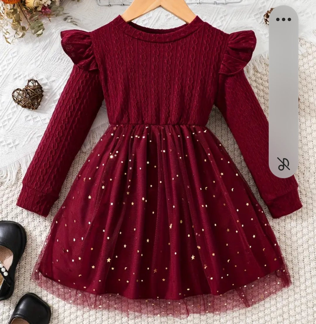 jurk voor Kerst. Bovenzijde van tricot en onderzijde van tule met gouden spikkels. In roze ,zwart en wijnrood  verkrijgbaar.