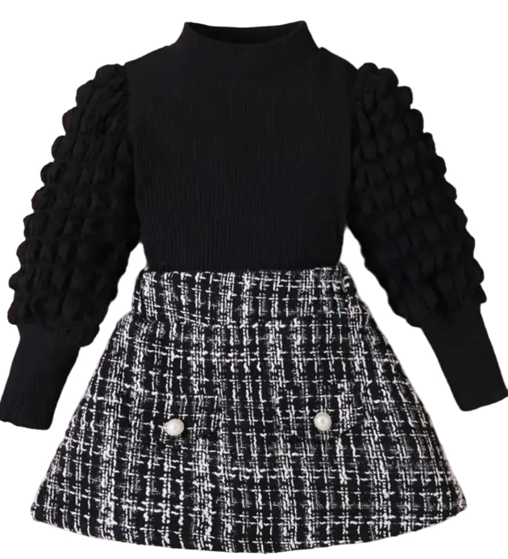 setje zwarte top met aparte mouwen en geruit rokje in zwart wit