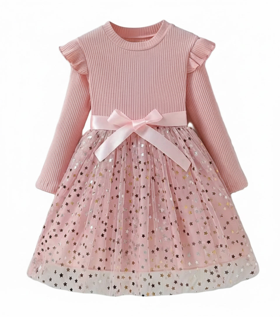 jurk voor Kerst. Bovenzijde van tricot en onderzijde van tule met gouden spikkels. In roze ,zwart en wijnrood  verkrijgbaar.